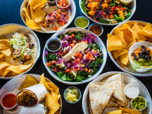 Mix of different dishes of food served at Neo Burrito