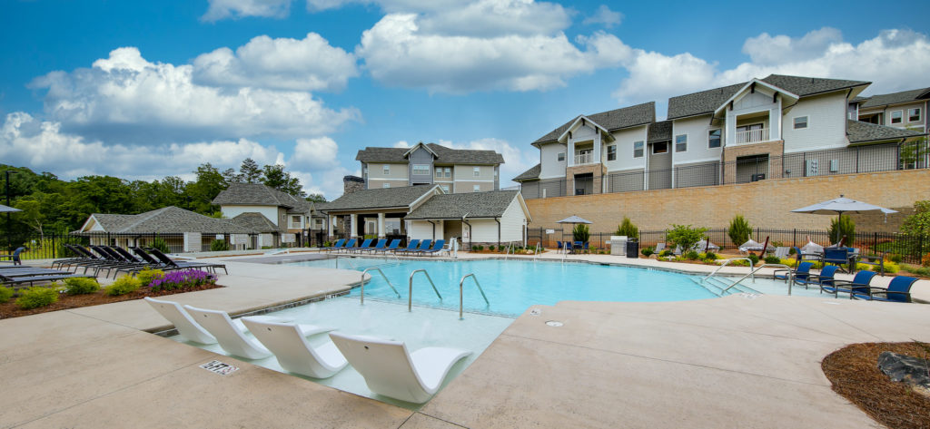 A photograph of their swimming pool area outside of the club house at this West Asheville apartment complex