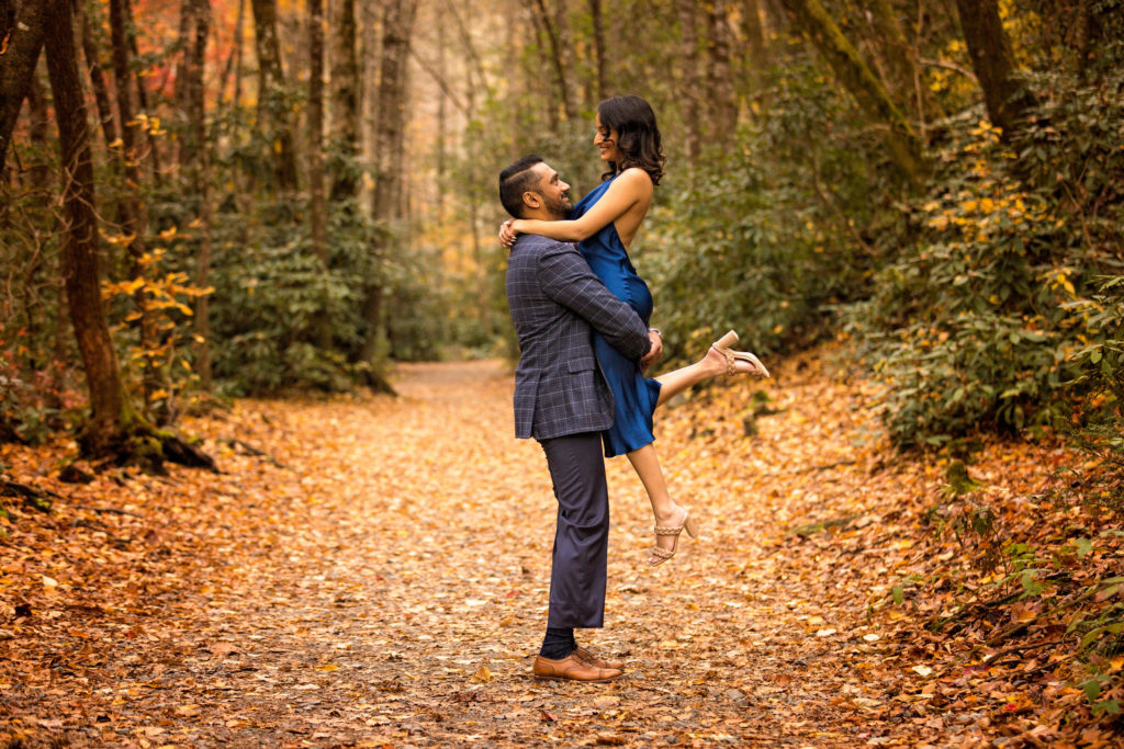 Engagement at Dupont State Forest in Brevard, NC Alok picking up Sunaina on one of the many trails.