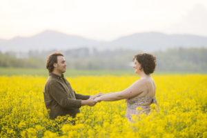 Biltmore proposal photos in field of yellow flowers