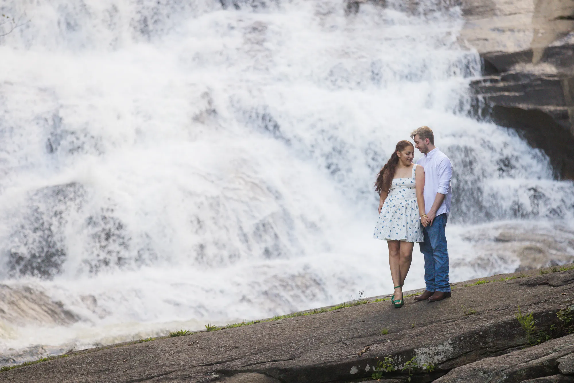 Just-engaged couple at Triple Falls on a summer afternoon, DuPont State Forest
