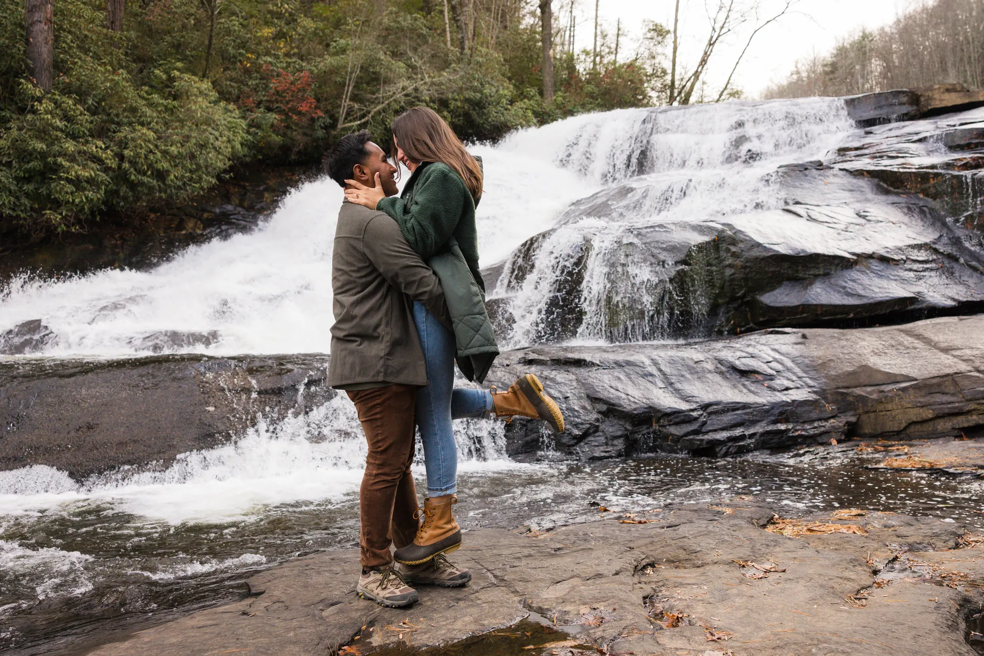 Lift and kiss celebration at Triple Falls, DuPont State Forest