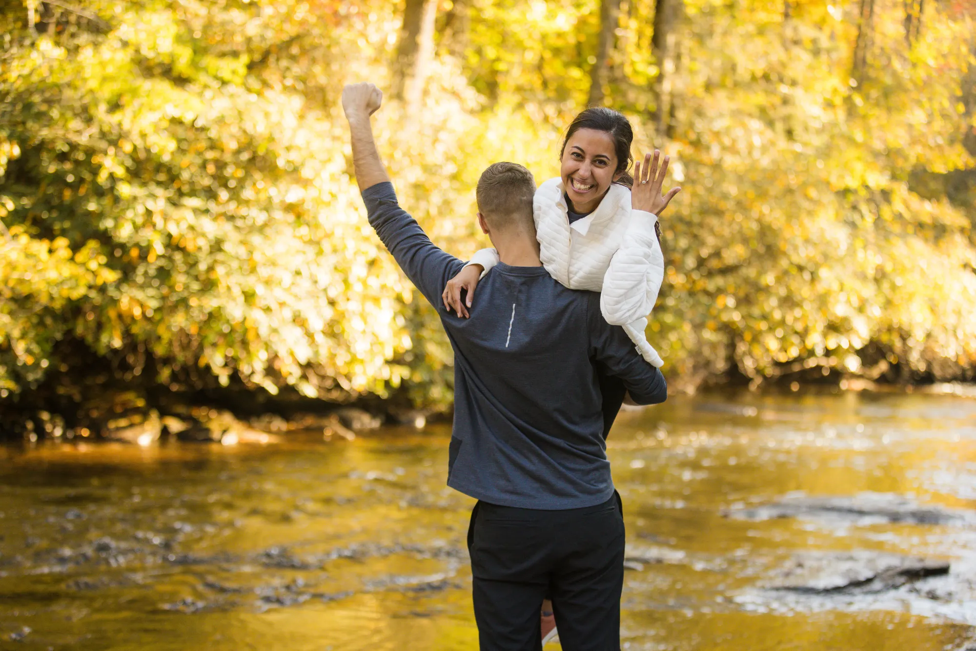 Celebrating over-the-shoulder with the new ring at Triple Falls, DuPont