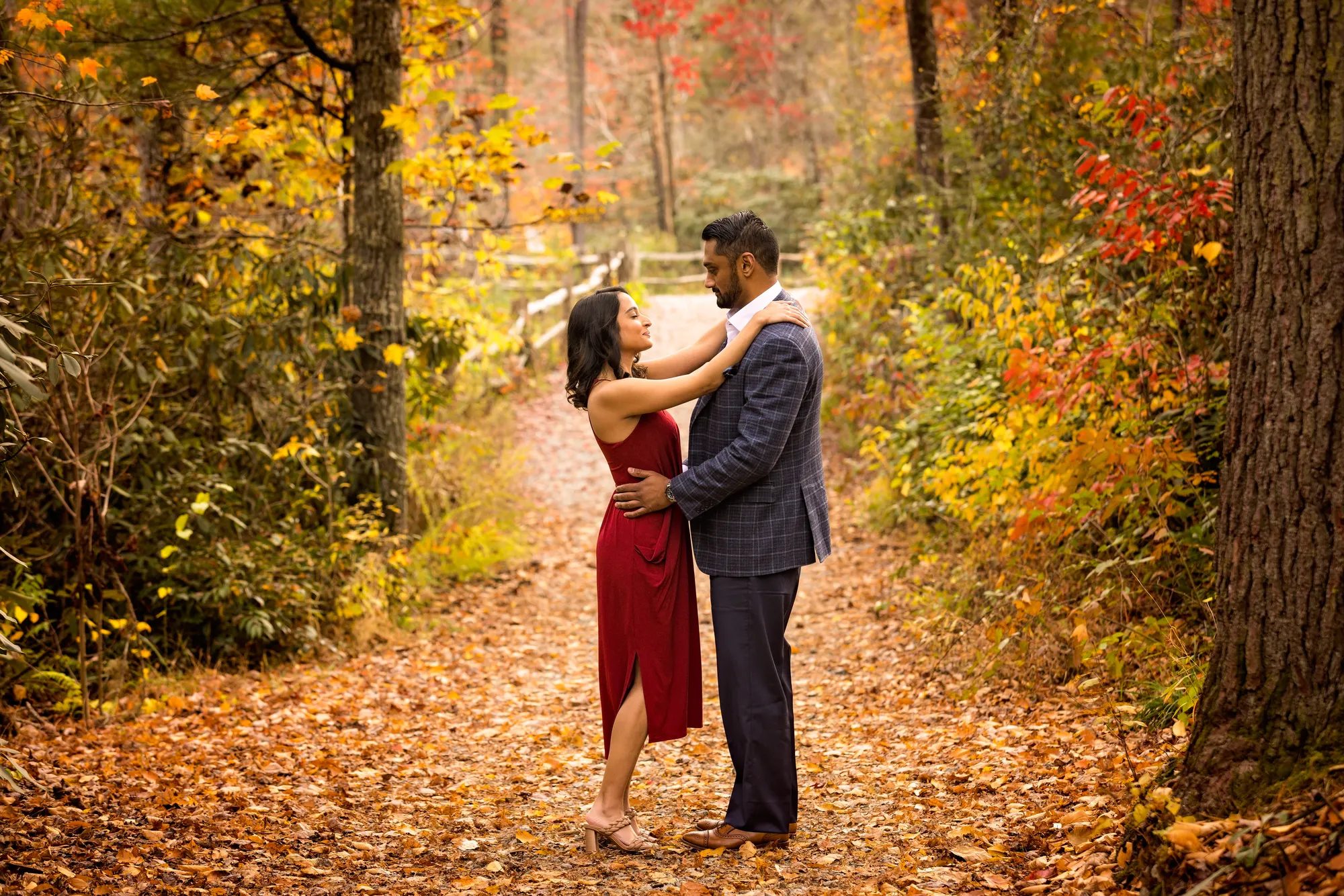 Fall color engagement session on a DuPont State Forest trail