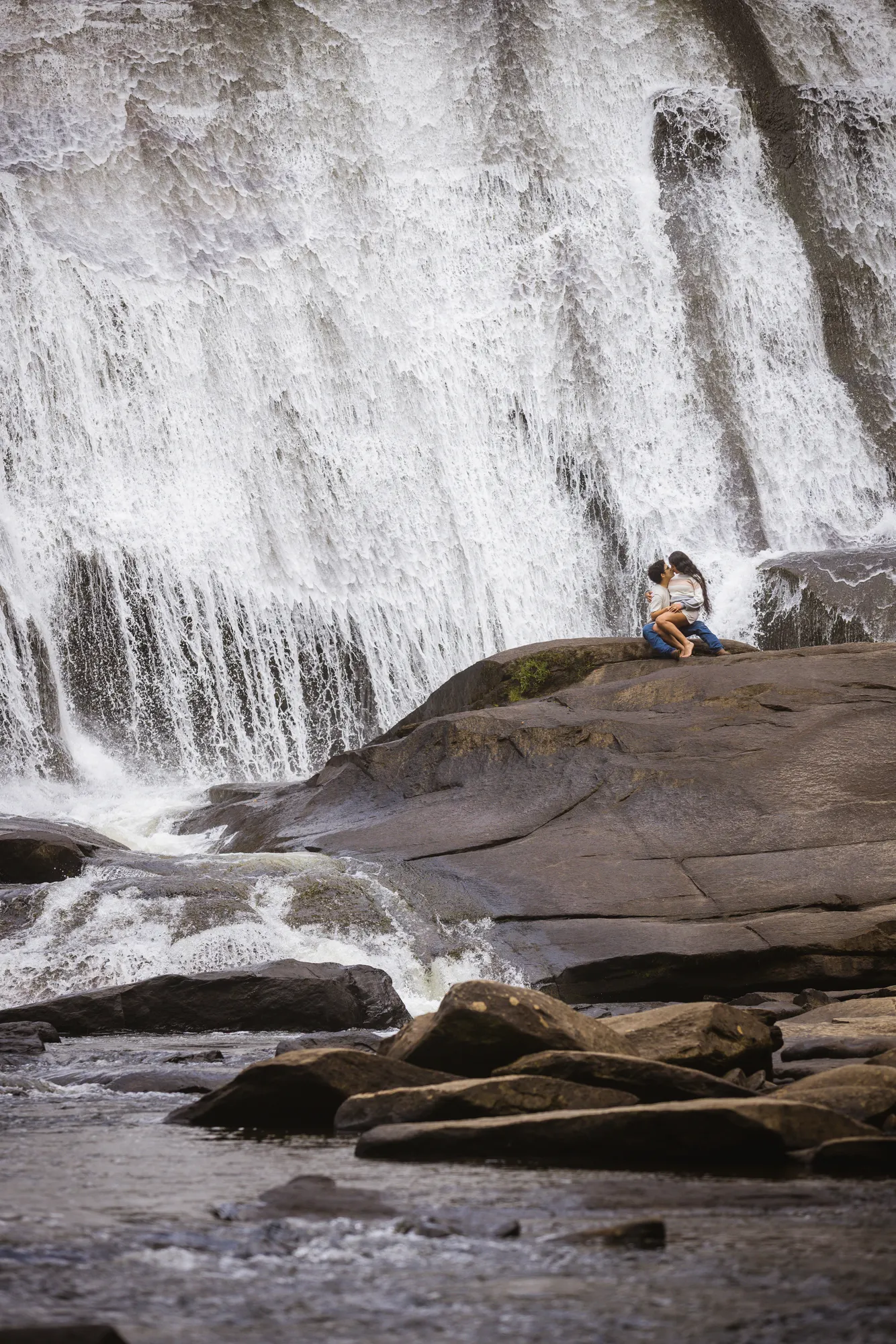 Engagement photos at the base of High Falls, DuPont NC