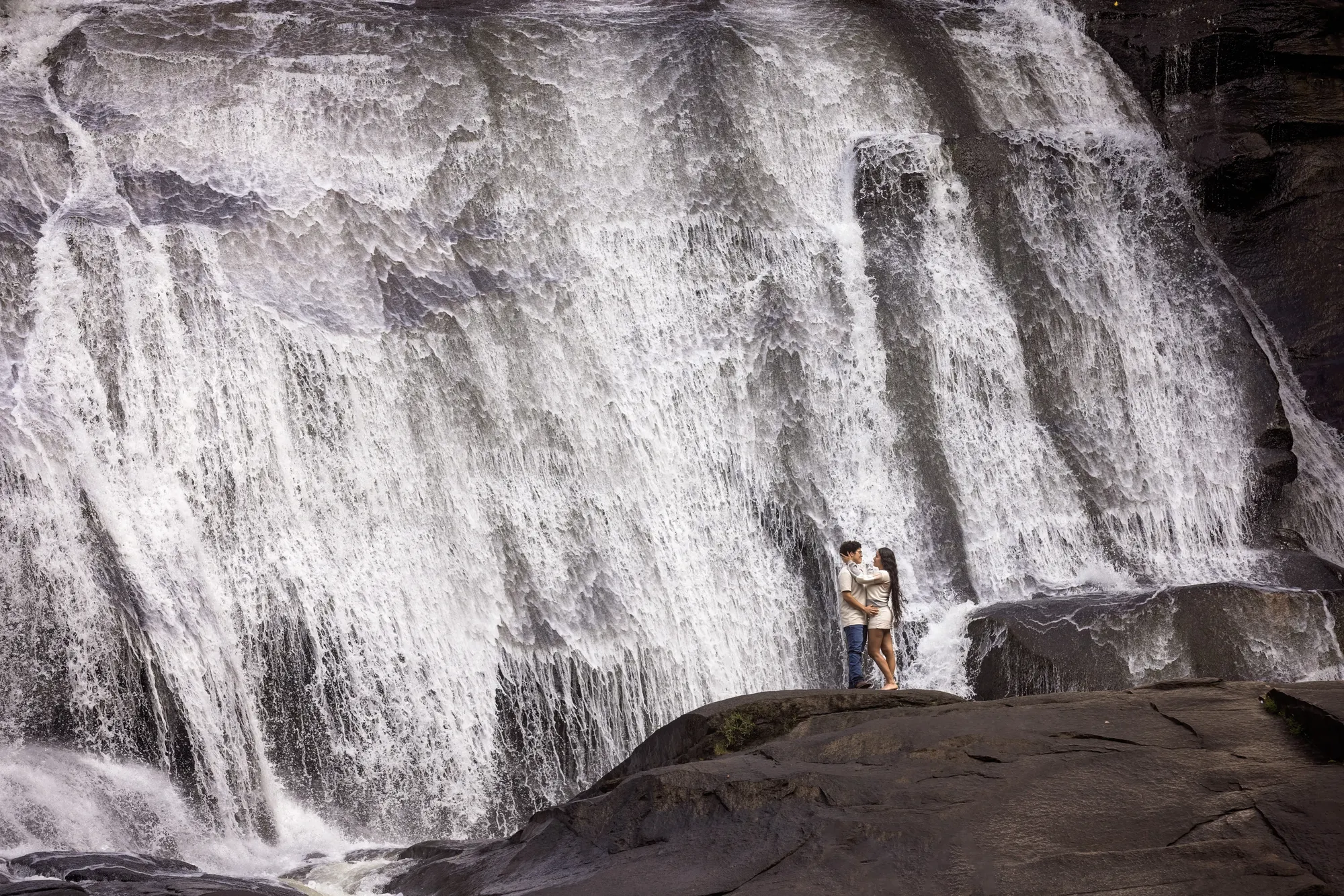 Engagement session at the base of High Falls, the tallest waterfall in DuPont State Forest