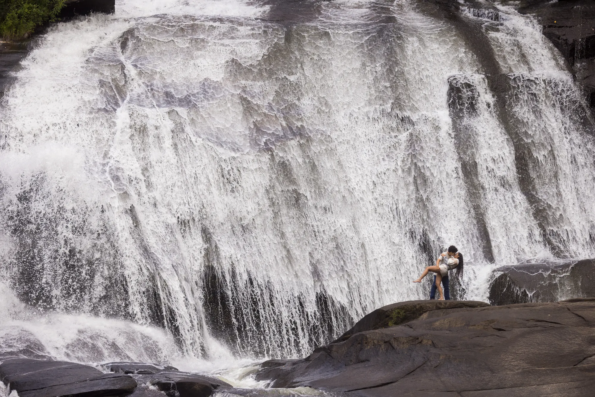 Couple at High Falls in summer, DuPont State Forest near Brevard