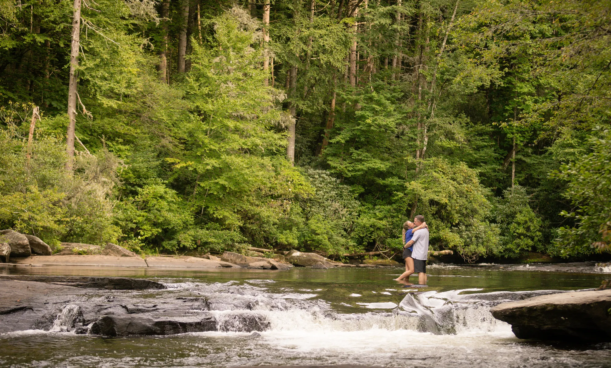 Crossing the river ledge in summer, DuPont engagement session