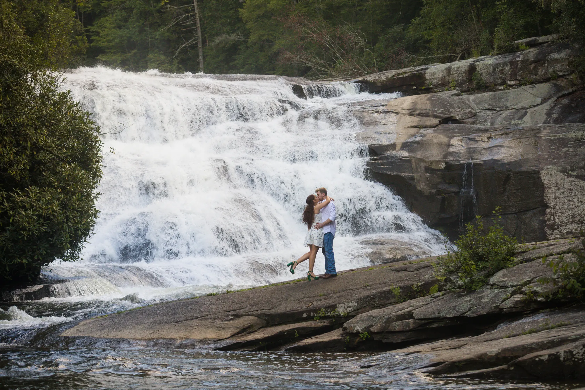 Lift and kiss waterfall engagement session, DuPont State Forest