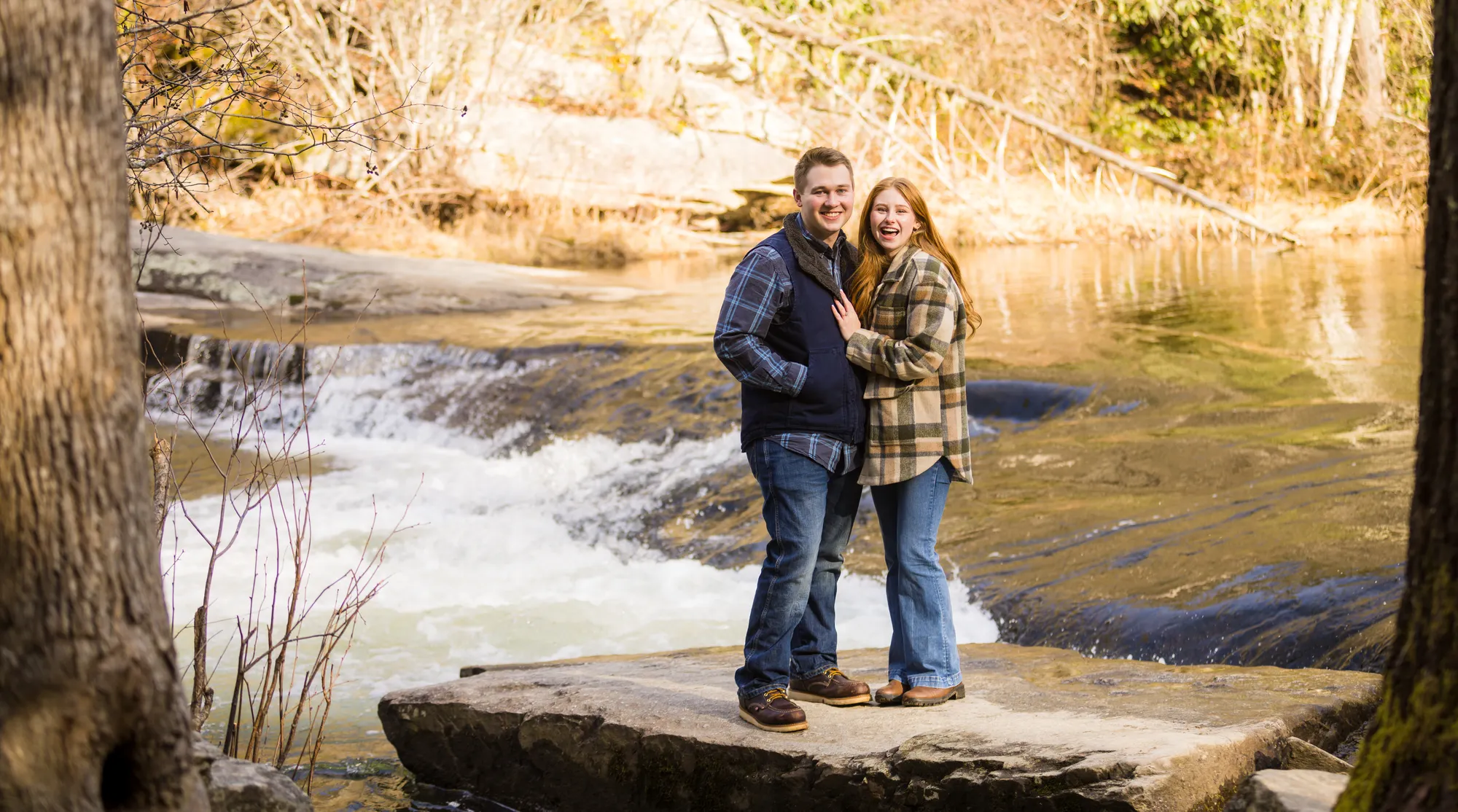 Winter couple on a boulder by the Little River, DuPont NC