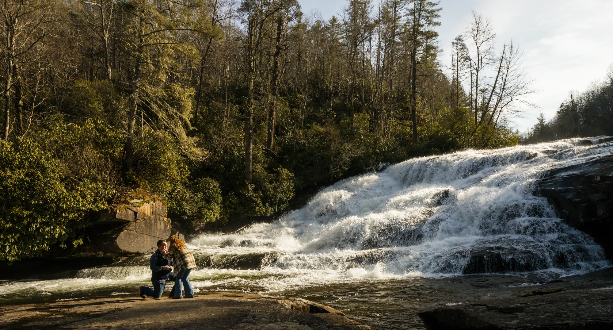 Winter proposal at Triple Falls, DuPont State Forest, bare trees and moody light